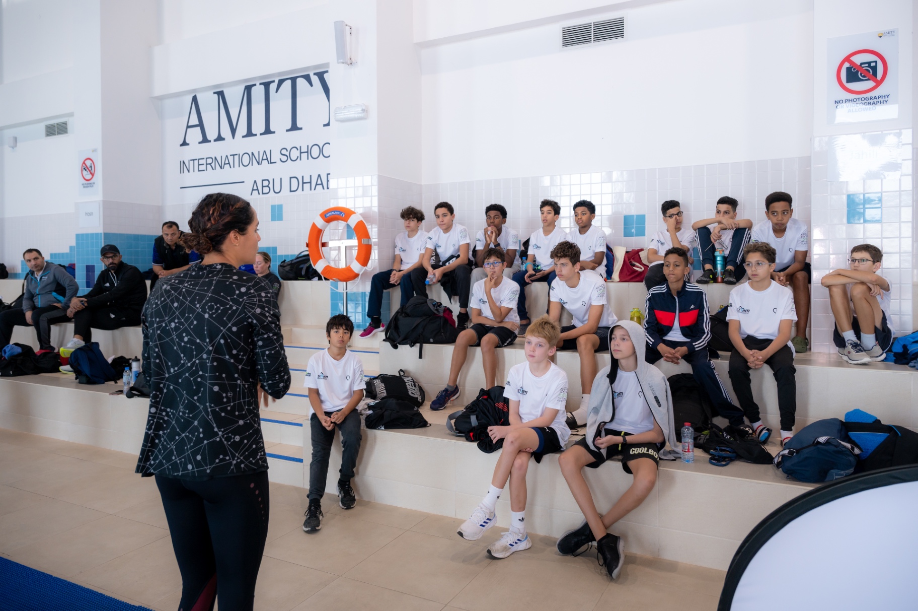 Dr Sarra Lajnef-Taylor addressing young swimmers at Amity International School Abu Dhabi