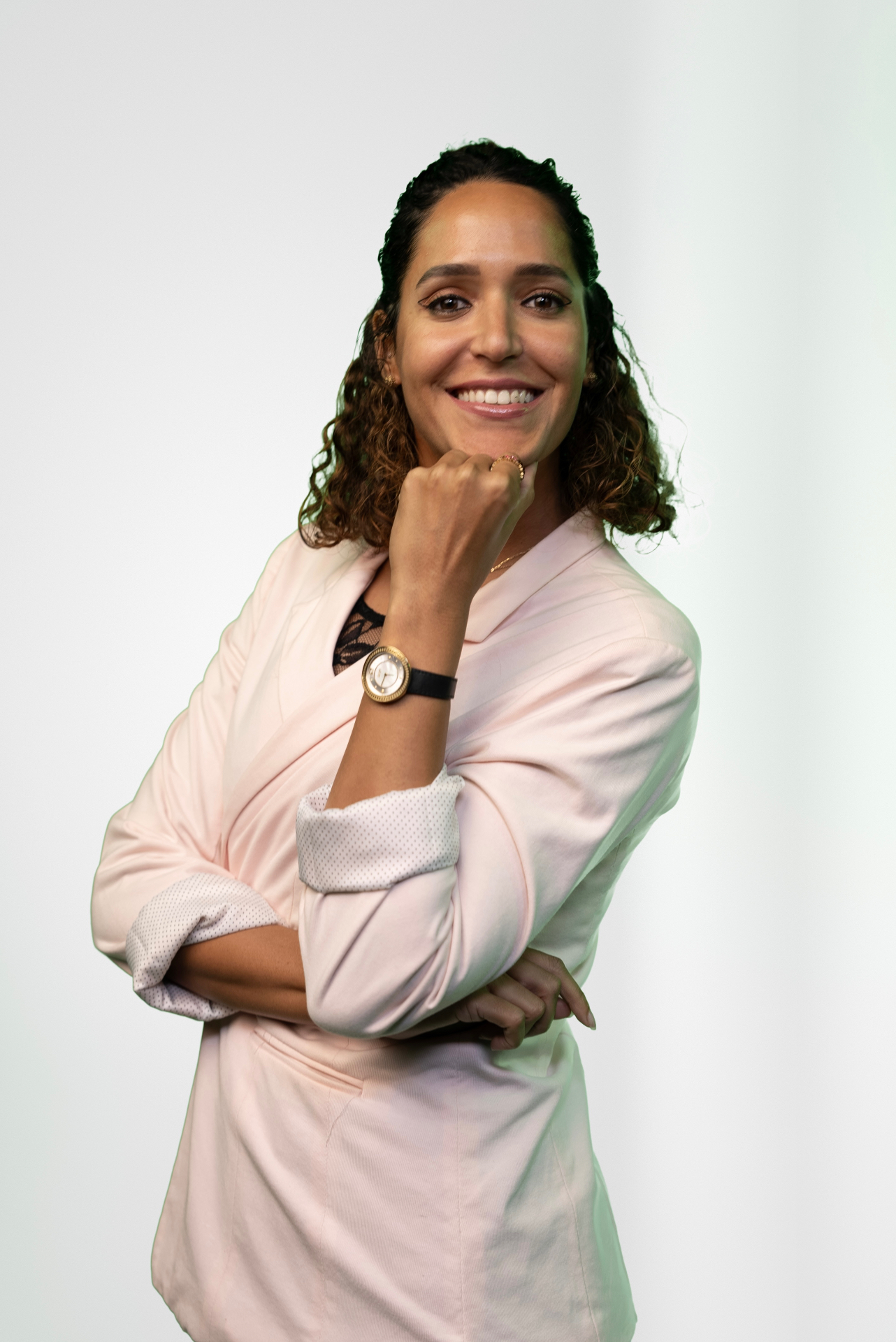 Editorial portrait of Dr Sarra Lajnef-Taylor in a rose jacket